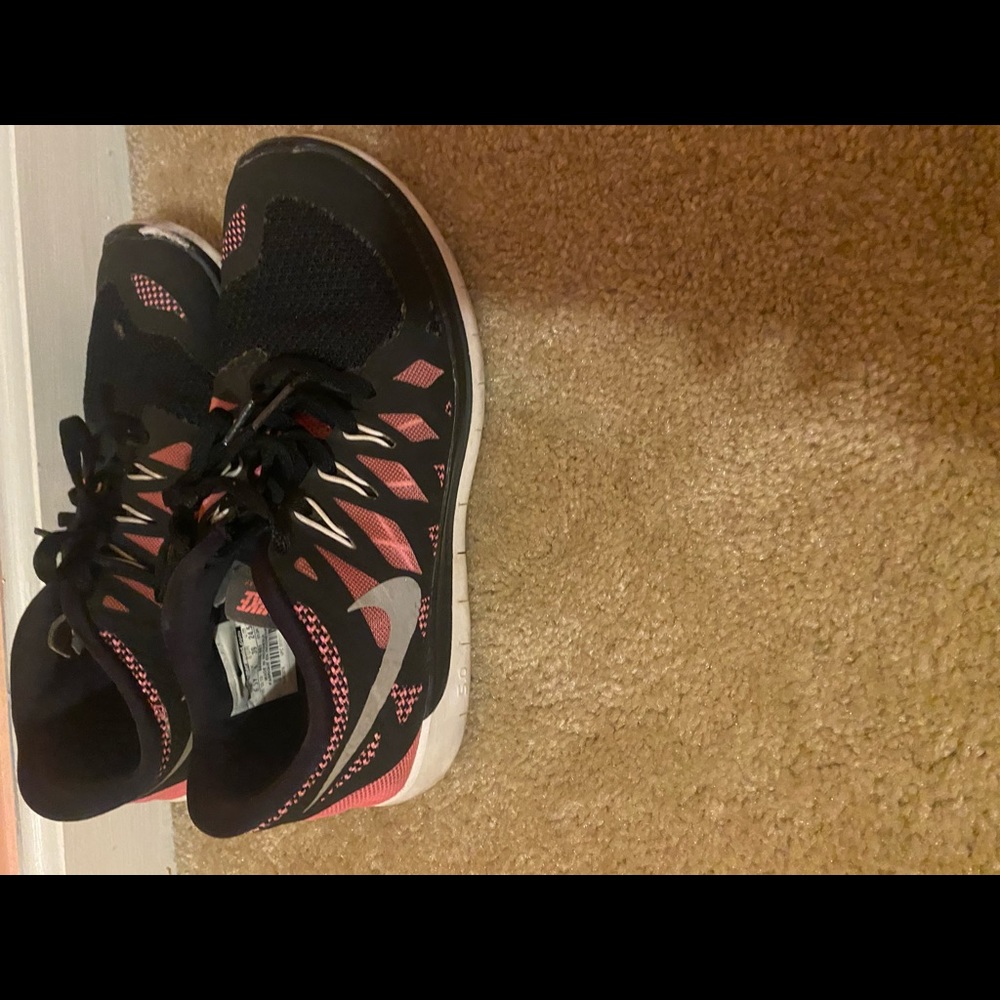 used, black and pink nike shoes